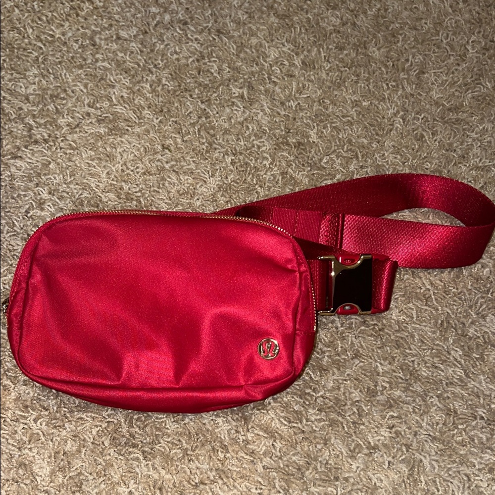 Red lululemon Belt Bag, special edition with gold hardware